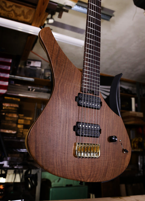 Dean Gordon guitars 7 string with walnut flatop.