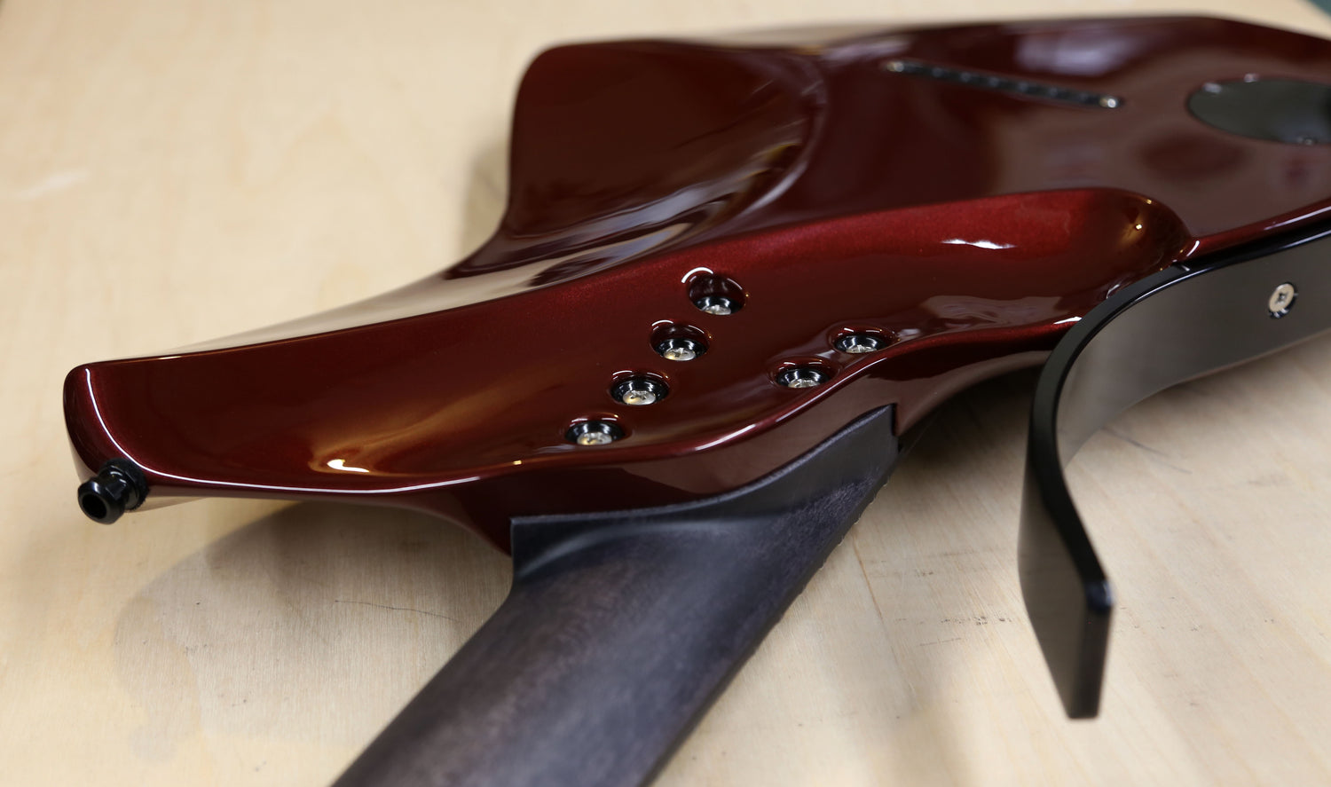 metallic red modern electric 7 string guitar